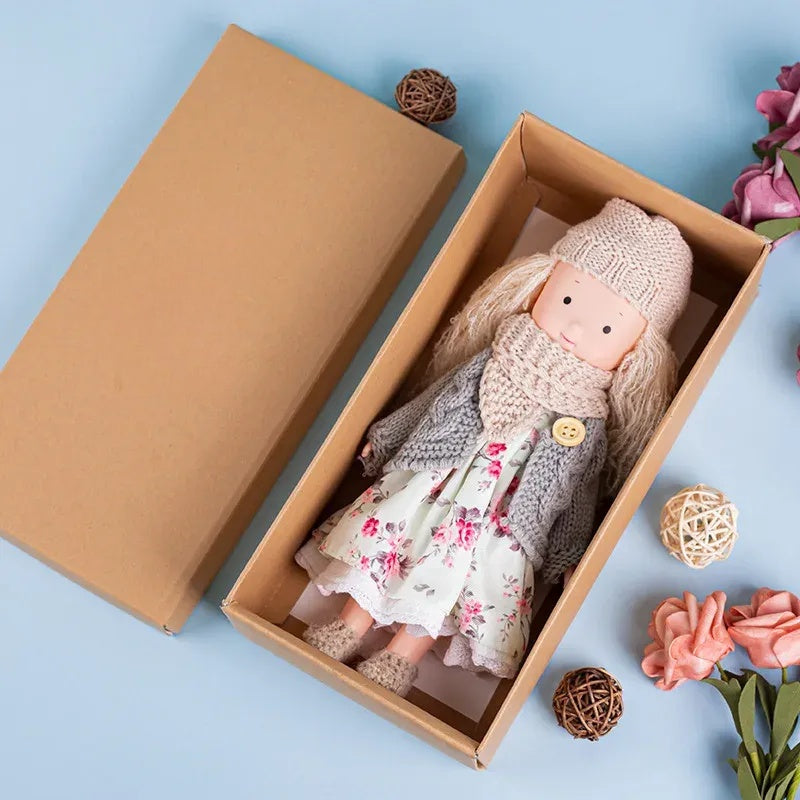 Dress-Up Plush Doll With Soft Vinyl Face And Removable Knitted Outfit