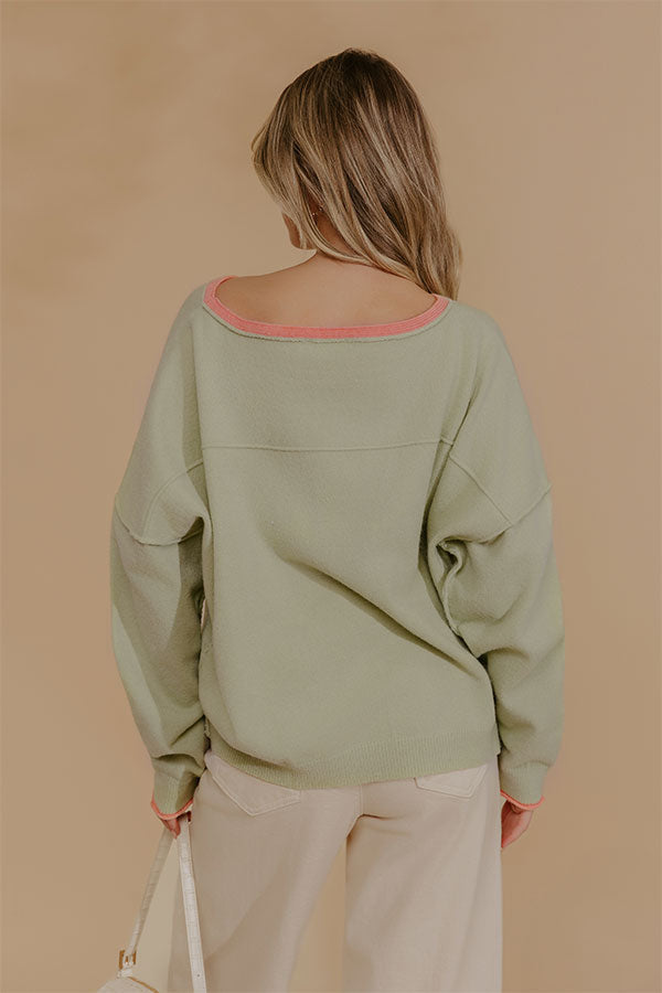 Oversized Knit Top with Coral Trim and Exposed Seam Details