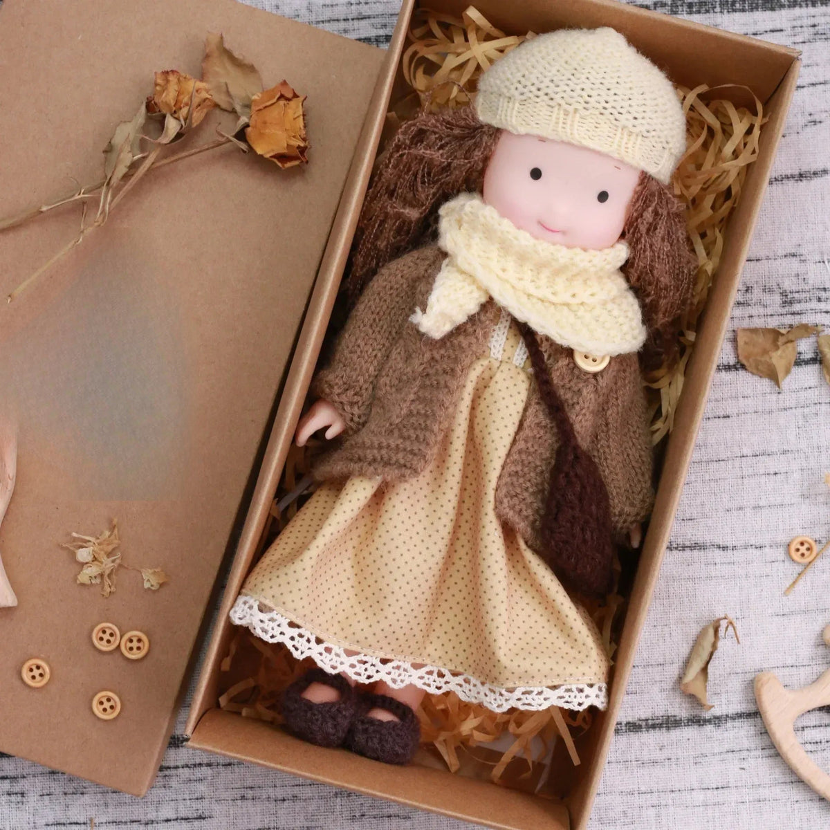 Dress-Up Plush Doll With Soft Vinyl Face And Removable Knitted Outfit