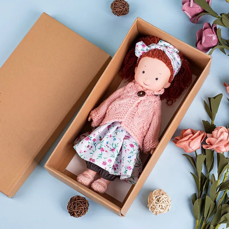 Dress-Up Plush Doll With Soft Vinyl Face And Removable Knitted Outfit