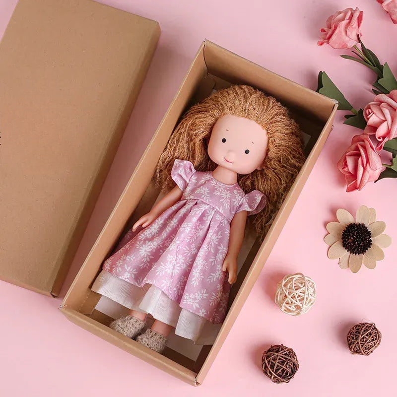 Dress-Up Plush Doll With Soft Vinyl Face And Removable Knitted Outfit