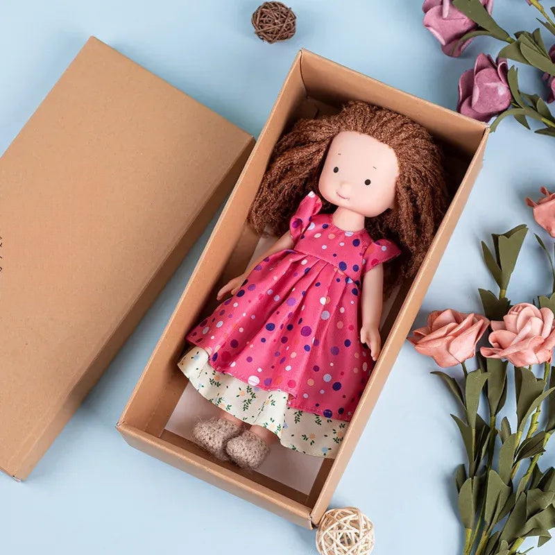 Dress-Up Plush Doll With Soft Vinyl Face And Removable Knitted Outfit