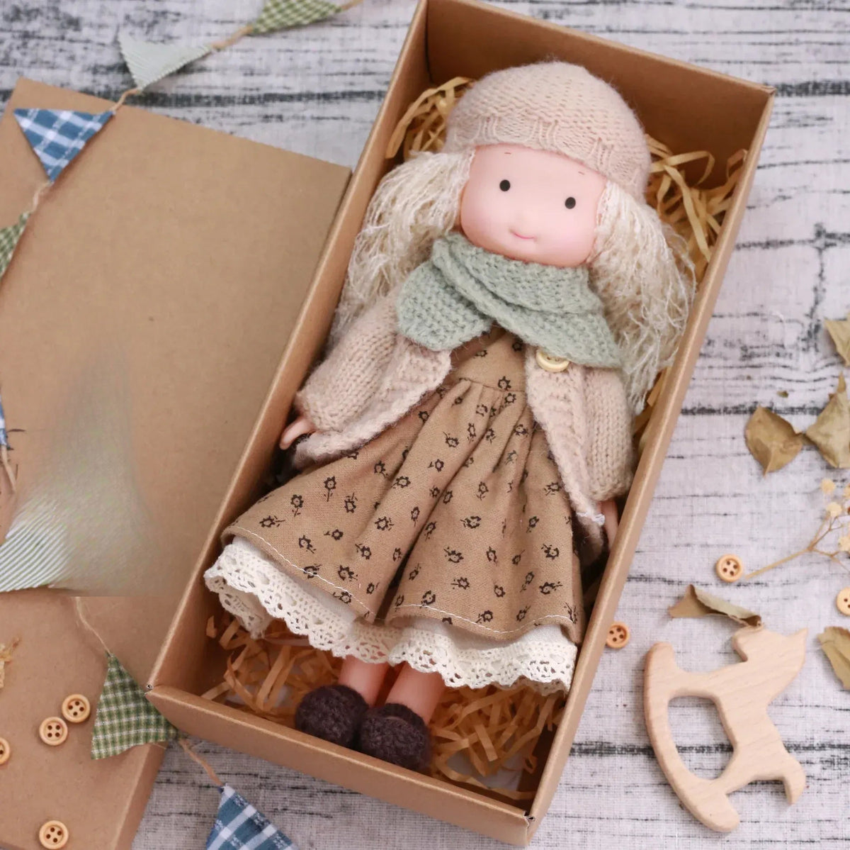 Dress-Up Plush Doll With Soft Vinyl Face And Removable Knitted Outfit
