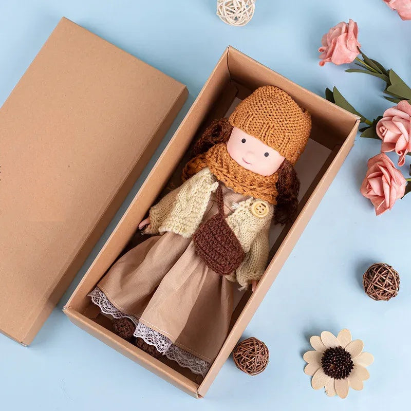 Dress-Up Plush Doll With Soft Vinyl Face And Removable Knitted Outfit
