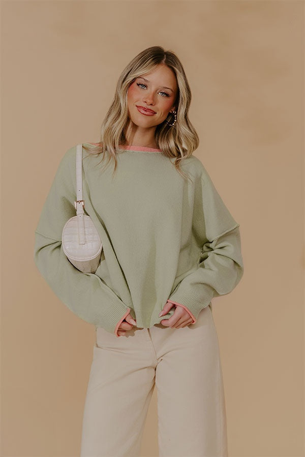 Oversized Knit Top with Coral Trim and Exposed Seam Details